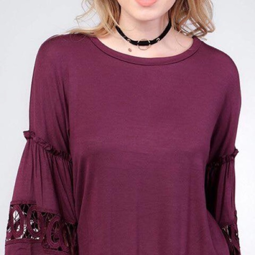 Burgundy blouse.